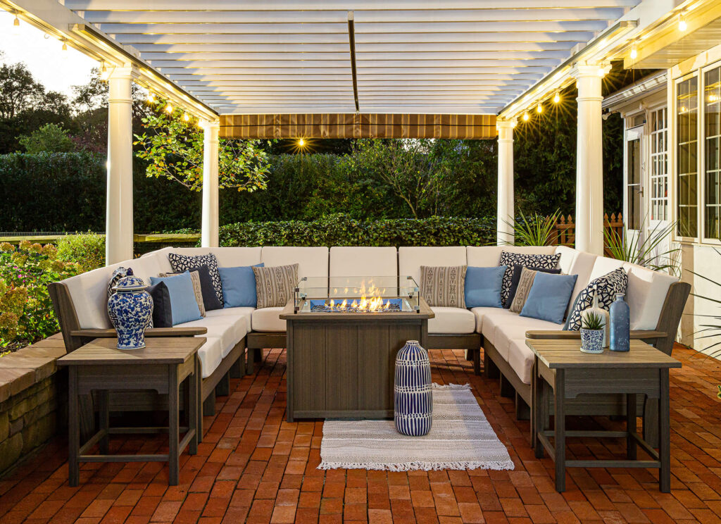 Reupholstered patio furniture on a deck under a pergola