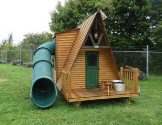 wooden triangular swing set with green accents