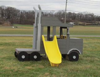 gray semi truck cab with a yellow slide