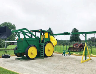 green and yellow tractor swing set