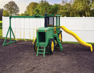 green and yellow tractor swing set with a yellow slide