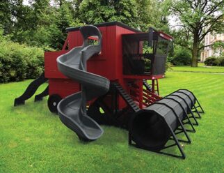 a red and black combine swing set in a grassy field