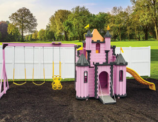 pink princess palace playset on a bed of mulch