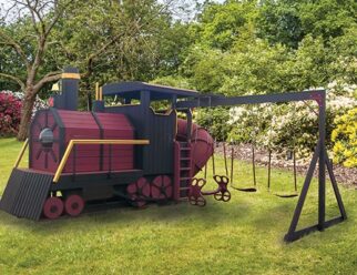 red and black train swing set in a grassy field