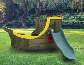 brown and yellow pirate ship playset in a grassy field