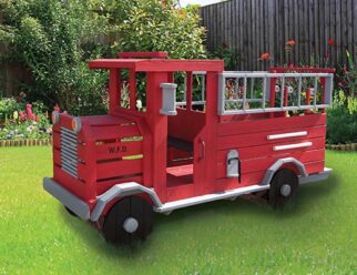 a red firetruck playset in a backyard