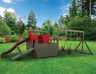 red and brown tug boat playset in a grassy field