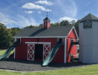 barn and silo playset in a grassy field