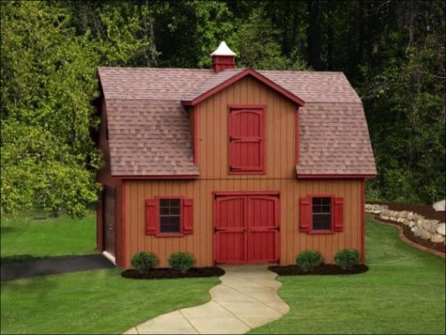 A brown and red backyard barn that has been converted into a house